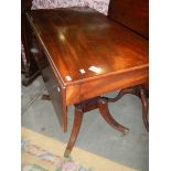 An antique drop leaf table.