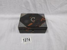 A faux tortoise shell trinket box with silver corners, a/f.