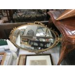 A gilt metal mirror