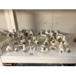 A large quantity of crested china including Goss