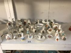 A large quantity of crested china including Goss