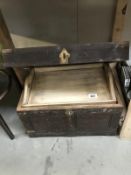 An Eastern wooden chest with brass corners and brass floral inlay