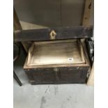 An Eastern wooden chest with brass corners and brass floral inlay