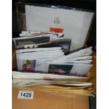 A box of coin covers, postcards, postal history etc.