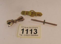 A 9ct gold bow brooch, a 9ct gold bar brooch and one other brooch (test as 9ct gold).