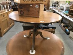 A 19/20th century oak tripod tea table