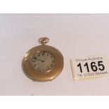 A 9ct gold pocket watch, monogrammed and dated 1918 (missing glass and in need of attention).