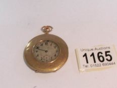 A 9ct gold pocket watch, monogrammed and dated 1918 (missing glass and in need of attention).