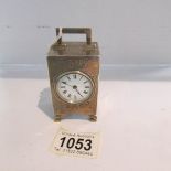 A hall marked silver miniature carriage clock with French movement, in working order.