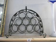 An ornate metal wine rack