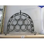 An ornate metal wine rack