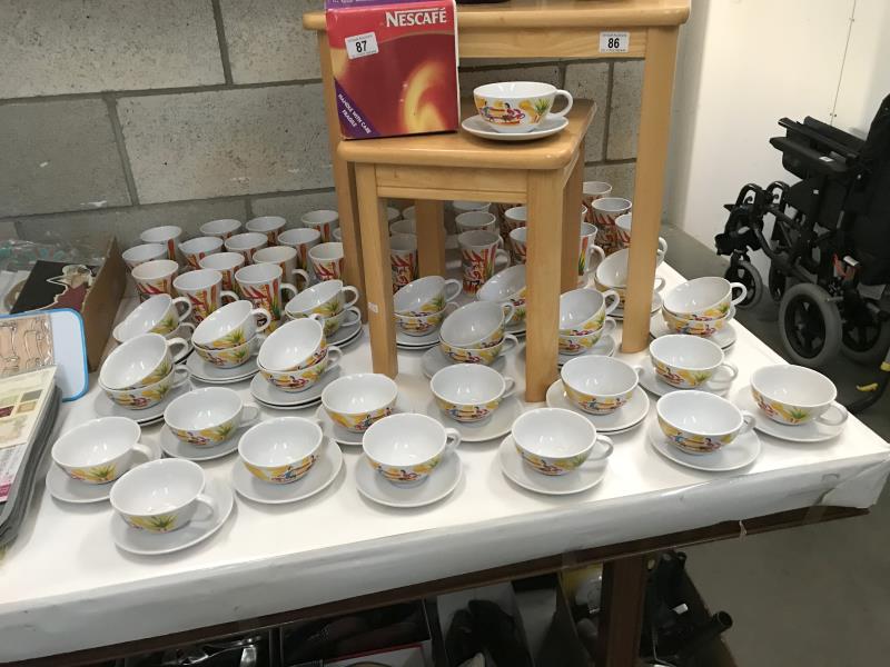 Large quantity of Nescafe mugs and cups and saucers,