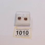 A pair of 9ct gold seed pearl and garnet earrings.