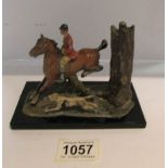 A 1930's cold painted spelter lighter of a huntsman on horse with dog.