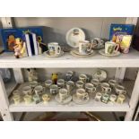 2 shelves of Sooty memorabila mainly from Keele pottery including egg cups, money boxes etc.