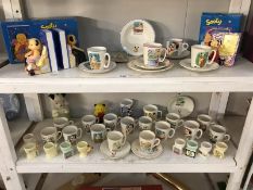 2 shelves of Sooty memorabila mainly from Keele pottery including egg cups, money boxes etc.