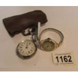 A ladies silver fob watch marked 0.935 and a ladies wrist watch with 9ct gold case.