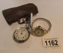 A ladies silver fob watch marked 0.935 and a ladies wrist watch with 9ct gold case.