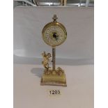 A vintage Estyma clock in the form of a cherub.