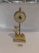 A vintage Estyma clock in the form of a cherub.