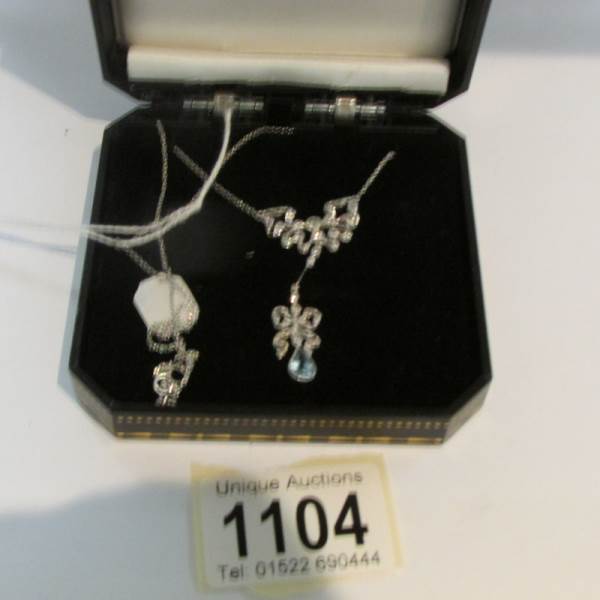 An 18ct gold diamond and aqua pendant necklace.