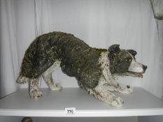 A plastic / resin sheep dog