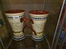 2 large twin handled motto ware vases.