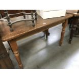 An oak topped dining table
