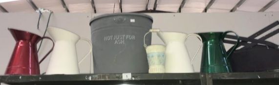 A metal bin with lid, 4 jugs etc.