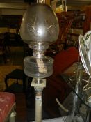 A Victorian silver plate Corinthian column oil lamp.