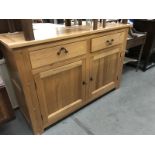 A modern solid oak 2 drawer 2 cupboard dresser base