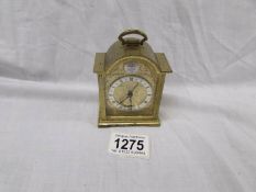A small brass Swiza bracket clock with alarm.