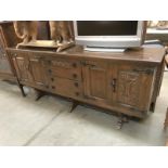 An oak rustic sideboard with iron handles