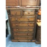 A solid pine chest of drawers