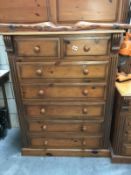 A solid pine chest of drawers