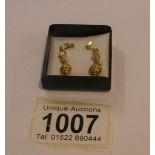A pair of 9ct gold pendant earrings.