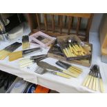 A large quantity of bone handled cutlery