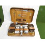 A 1930's gentleman's travelling vanity set with plaque inscribed 'S.W.G.B. 24th Dec. 1937'.