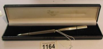 A cased silver letter opener, approximately 20 grams.