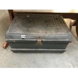 An ornate vintage metal travel trunk
