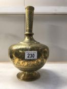 A Persian brass bottle vase