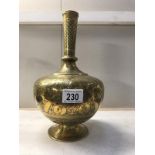 A Persian brass bottle vase