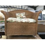 A 2 seater children's wicker seat