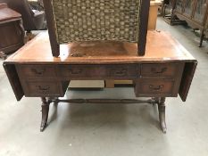 A Sutherland table style writing desk with drop ends a/f