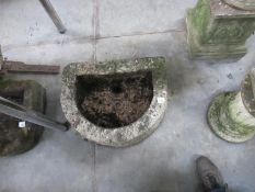 A D shaped stone planter