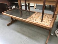 A continental teak coffee table and glass and tile top