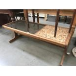 A continental teak coffee table and glass and tile top