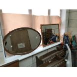 An oval mirror and 1 other