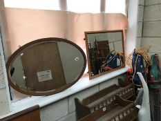 An oval mirror and 1 other