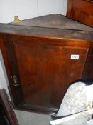 A Victorian mahogany corner cupboard